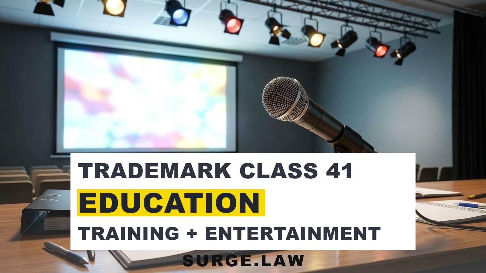 Stage microphone, projector, and training materials representing trademark class 41 education and entertainment services